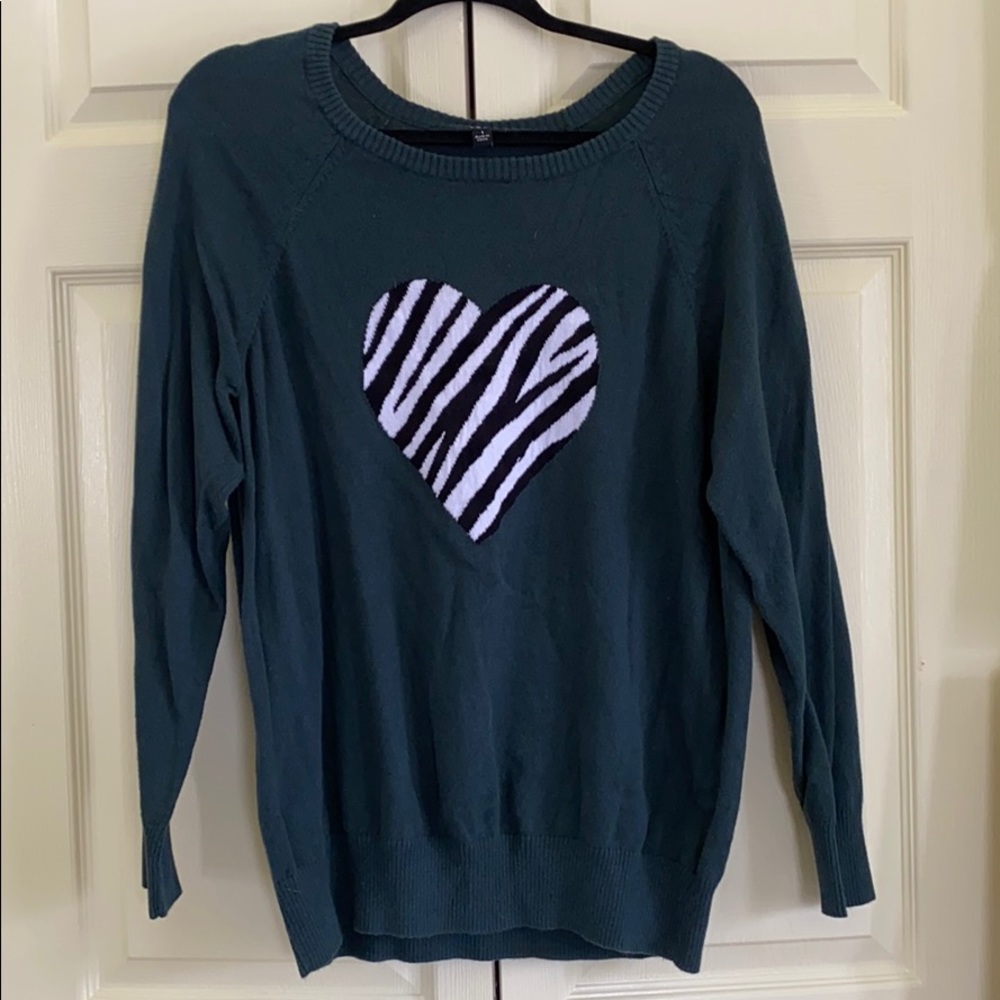 Lightweight sweater with cute heart.